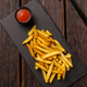 French fries with ketchup on dark wooden background top view - fast food and unhealthy eat concept - PhotoDune Item for Sale