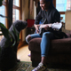 Happy african woman playing the guitar next to a dog - PhotoDune Item for Sale