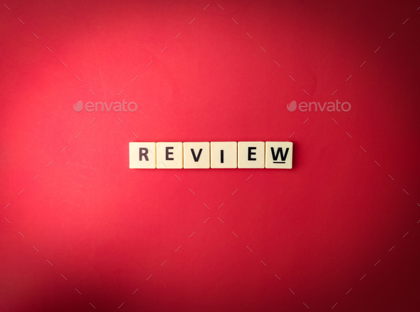 Toys word with the word REVIEW on red background - Stock Photo - Images