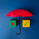 Red umbrella and colored cube with sign wrong and right on blue background. - PhotoDune Item for Sale
