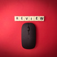 Toys word and wireless mouse with the word REVIEW on red background - PhotoDune Item for Sale