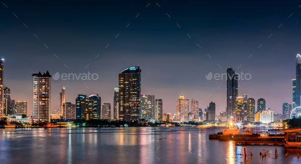 Cityscape of modern building near the river in the night. Modern architecture office building.  - Stock Photo - Images