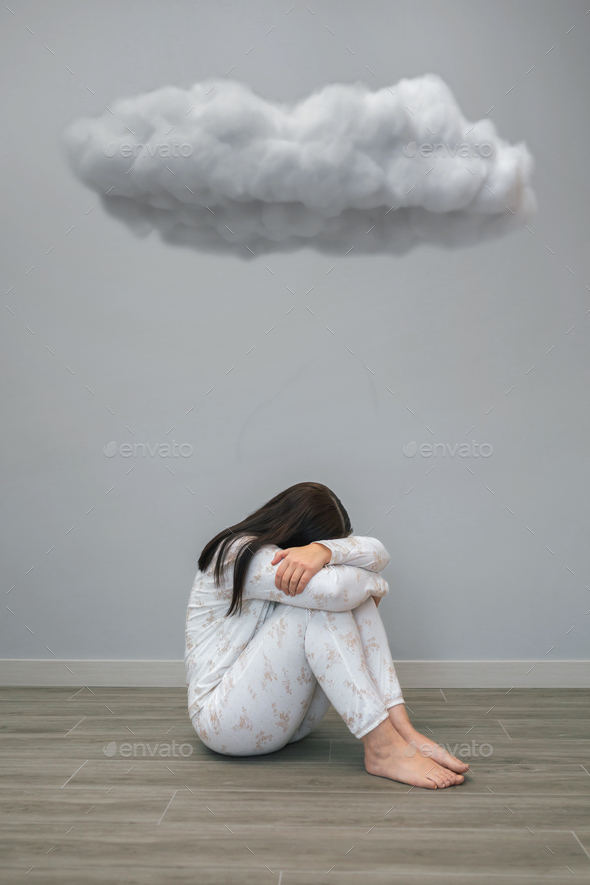 Woman with mental disorder and suicidal thoughts crying under a dark cloud - Stock Photo - Images