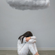 Woman with mental disorder and suicidal thoughts crying under a dark cloud - PhotoDune Item for Sale