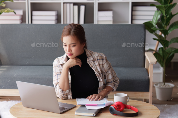 Accountant woman working on laptop and do document, tax, exchange, research, accounting and - Stock Photo - Images