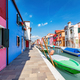 Burano, Italy with colorful painted houses along canal with boats - PhotoDune Item for Sale
