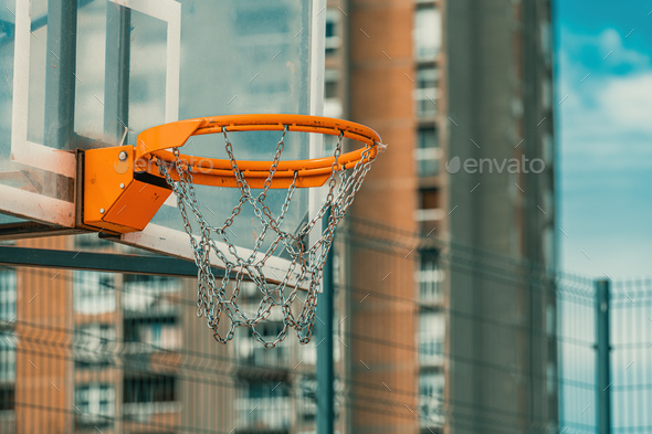 Outdoor basketball backboard and hoop rim with chain net in urban residential district - Stock Photo - Images