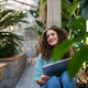 Portrait of young woman in botanical garden. - PhotoDune Item for Sale