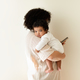 Busy black millennial mom hold little baby, enjoy motherhood, chatting on smartphone - PhotoDune Item for Sale