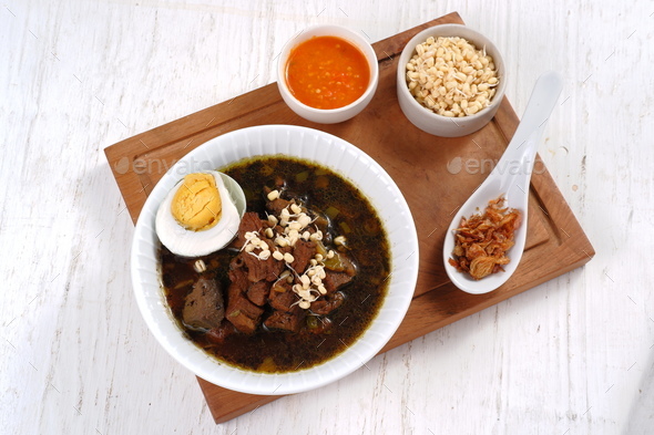 Rawon is Beef Black Soup Originally from East Java, Indonesia.served with salted egg,bean sprouts,an