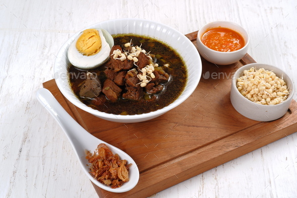 Rawon is Beef Black Soup Originally from East Java, Indonesia.served with salted egg,bean sprouts,an