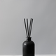 Bamboo sticks in a black bottle with indoor perfumes. Glass diffuser with fragrance for home. - PhotoDune Item for Sale