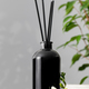 Black glass diffuser with the scent of flowers. The concept of home comfort, perfumes for the room. - PhotoDune Item for Sale