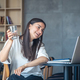 Young woman with a glass of water in front of a laptop. - PhotoDune Item for Sale