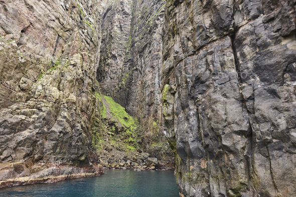 Rocky coastline cliffs landscape in Faroe islands. Vagar island - Stock Photo - Images