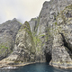 Stunning green cliffs and cave. Atlantic ocean, Faroe islands. - PhotoDune Item for Sale