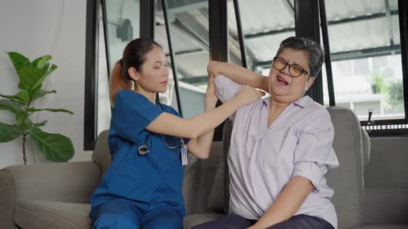 Nurse doing arm exercises for elderly people in nursing homes, health care concept