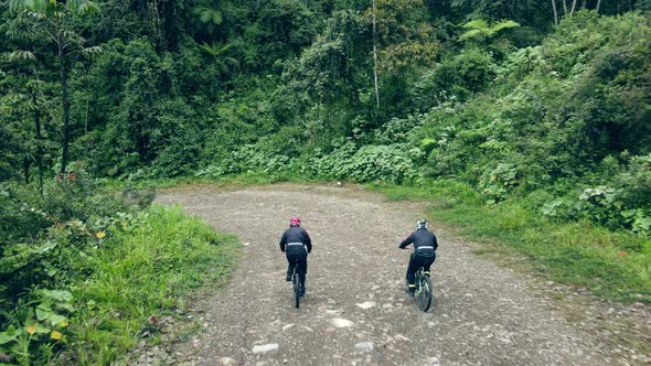 Drone Follows Two Mountain Bikers Riding on Road of death, Yungas Road, Bolivia