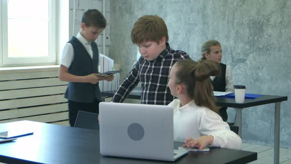 Little Office Kids Working with Documents and Laptop Computer in Office alt