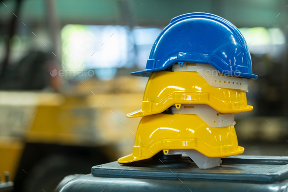 Yellow and blue helmet or hard hat for head safety in industry factory. equipment safe of worker con
