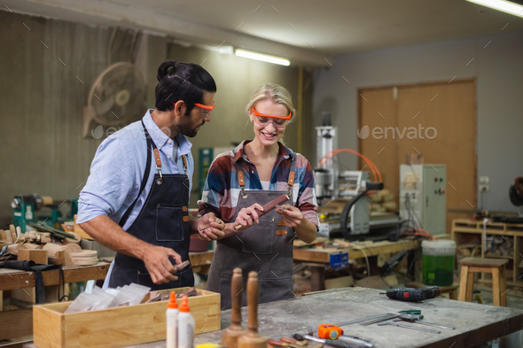 professional carpenter man working with woodwork industry tool