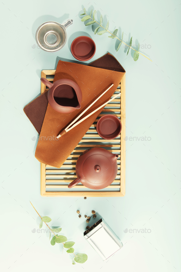 Beautiful set for traditional tea ceremony on pastel blue background - Stock Photo - Images