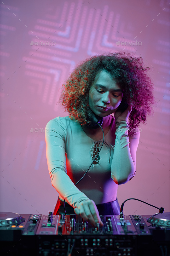 Young woman DJ making music - Stock Photo - Images