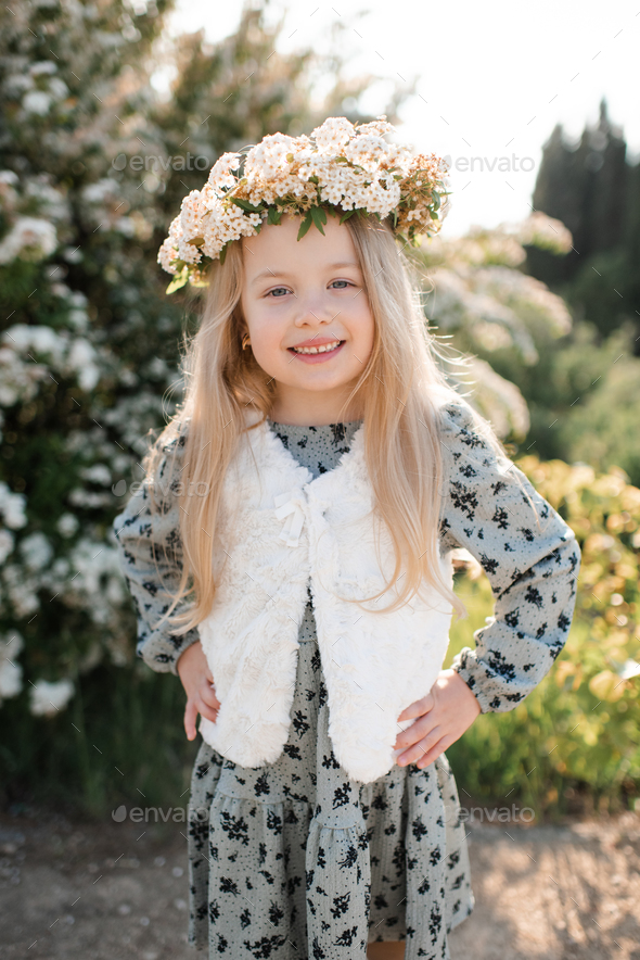 Cute stylish baby girl with flowers outdoor - Stock Photo - Images
