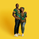 Happy beautiful black couple in national african costumes embracing - PhotoDune Item for Sale
