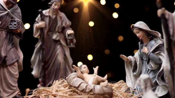 Jesus Christ Nativity Scene with Figurines and Light Particles