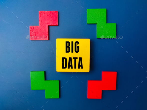 Colored wooden puzzle and wooden cube with word BIG DATA. - Stock Photo - Images