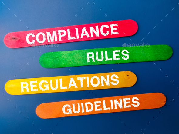 Colored ice cream stick with the word COMPLIANCE RULES REGULATIONS GUIDELINES. - Stock Photo - Images