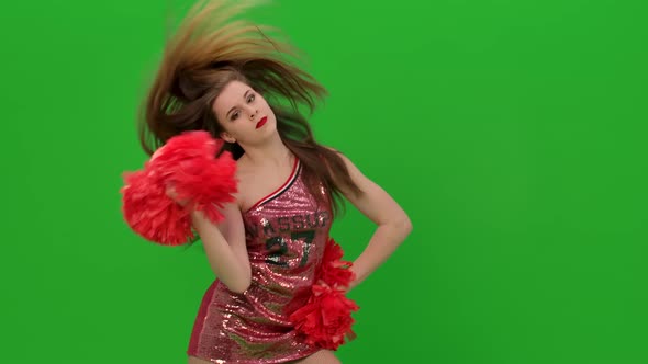 A Charming Girl Moves Her Arms and Hips Waves Her Hair alt