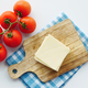 Slicing cheese into pieces and tomato on table  - PhotoDune Item for Sale