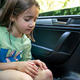 Close-up of little girl holding her bruised injured damaged knee with her hands. - PhotoDune Item for Sale