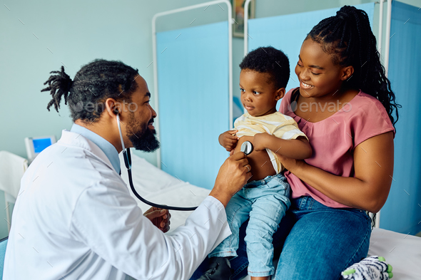 Small black boy during medical examination at pediatrician's office. - Stock Photo - Images