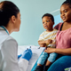 Black mother and son communicating with female pediatrician at doctor&#39;s office. - PhotoDune Item for Sale
