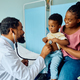 Small black boy during medical examination at pediatrician&#39;s office. - PhotoDune Item for Sale