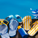 Beach flip-flops and sunglasses on wooden planks near swimming pool - PhotoDune Item for Sale