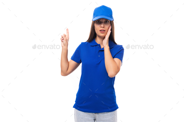 delectable pretty young caucasian brunette advertiser woman dressed in a clean blue polo t-shirt and - Stock Photo - Images