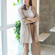 Businesswoman in green office looking out of window. Work concept. - PhotoDune Item for Sale