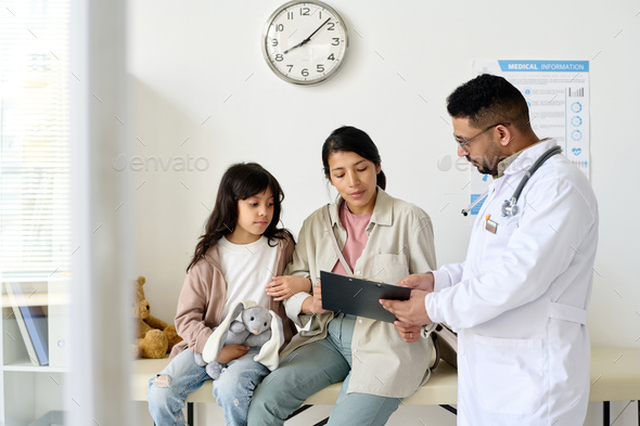Doctor telling about diagnosis to woman - Stock Photo - Images