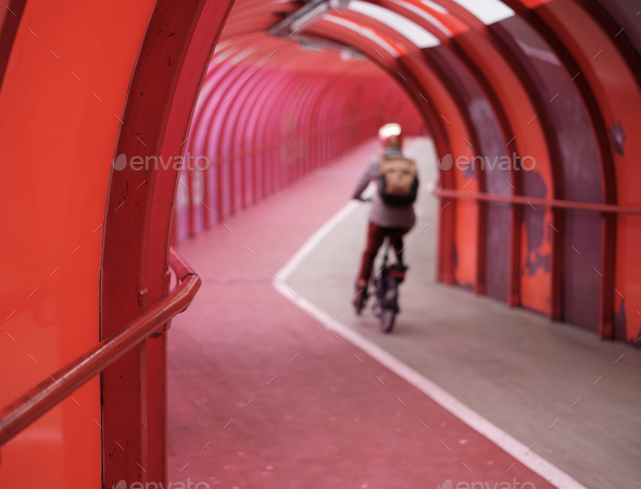 Commuting Cyclist In Urban Walkway - Stock Photo - Images