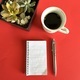 Notepad and pen with coffee cup and plant - PhotoDune Item for Sale