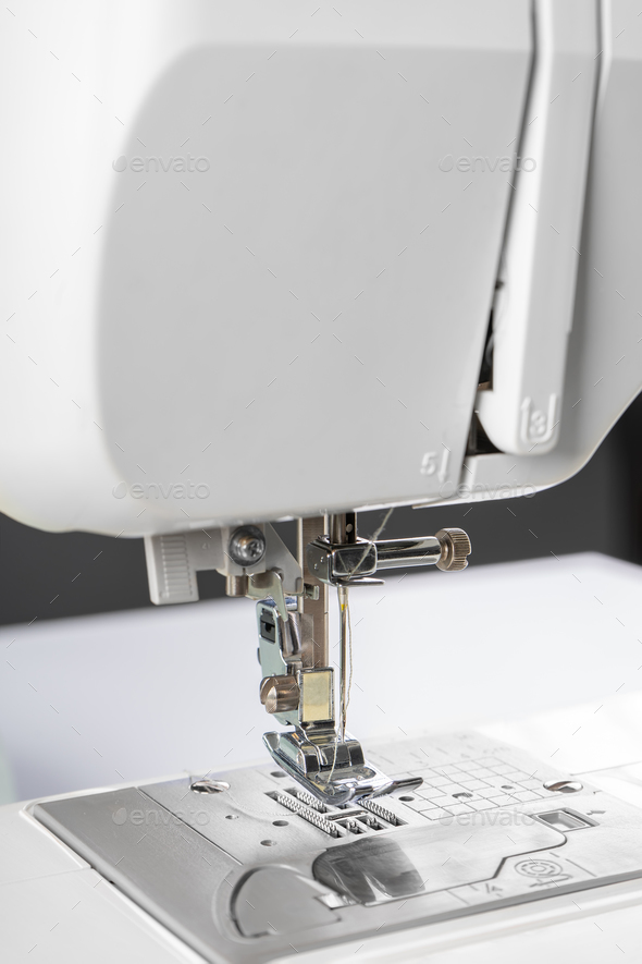 Modern White Sewing Machine Presser Foot Closeup, Macro - Stock Photo - Images