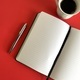 Notebook and pen with coffee on red background  - PhotoDune Item for Sale