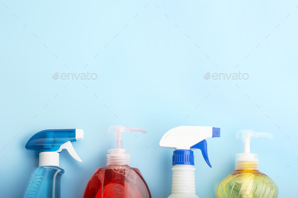 Cleaning products on blue background with copy space, spring cleaning  concert Stock Photo by tkasperova