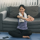 Asian woman stretching during a yoga class with at home. - PhotoDune Item for Sale