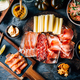 Appetizers with different antipasti, charcuterie, snacks, meat platter with cheese and spicy olives - PhotoDune Item for Sale