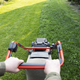 Lawn mover on green grass. Machine for cutting lawns. - PhotoDune Item for Sale